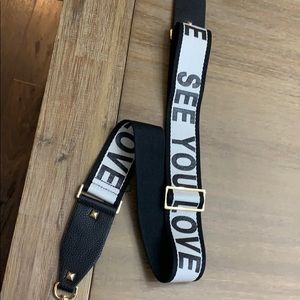 Guitar strap for a purse. Never worn